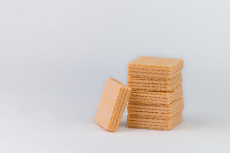 The orange-flavoured wafer Closeup is arranged on top of many pieces and the wafer has an orange...