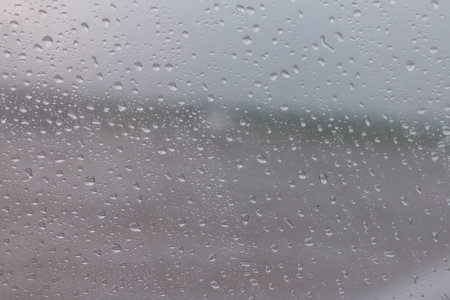 The raindrops are attached to the clear glass in front of the car. When it rains During the day...