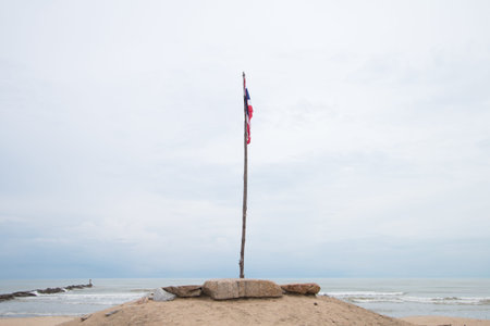 The flagpole of Thailand is made of wood on the beach on the southern coast of Thailand on a...
