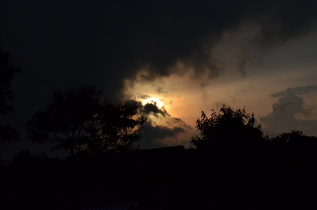 Sunset and dark clouds obscured the light.の写真素材