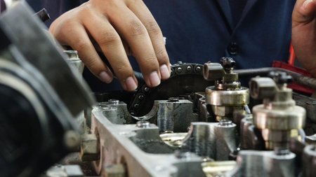 Mechanic, Car mechanic is providing engine maintenance service. in the garage.