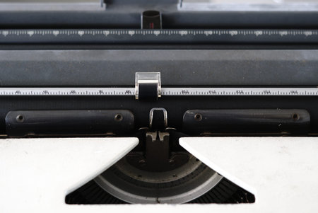 Close-up of a typewriter with a black and white sheet of paper