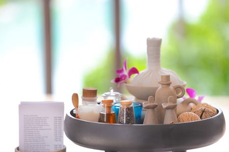 Spa & aromatherapy set including perfumes, oil jar, herbal ball and orchid flowersの写真素材