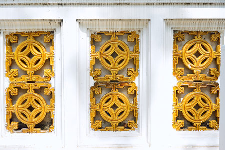 Wall with stone carving at Wat Suthat Thep Wararam, Bangkok, Thailandの写真素材