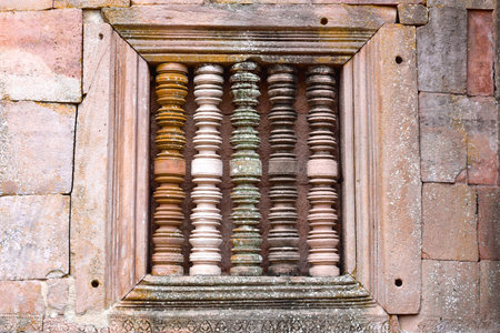 Solid window frame with baluster at at main tower of Phanom Rung Historical Park, Buriram, Thailandの写真素材