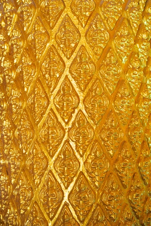 Golden angels pattern on the pillars of Phra That Nongbua Pagoda, Ubon Ratchathani, Thailandの写真素材