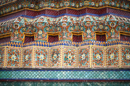 Chinese-influenced mosaic on the base of a pagoda at Wat Pho or Temple of the Reclining Buddha, Bangkok, Thailandの写真素材