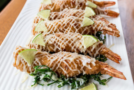 Fried Shrimp with cream salad and lemonの写真素材