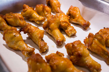 Grilled chicken wings on a platterの写真素材