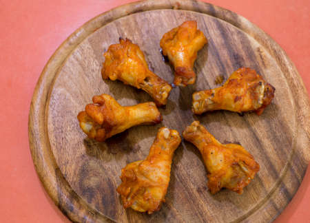 Grilled chicken wings on a platterの写真素材
