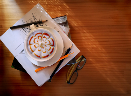 cappuccino coffee on bookの写真素材
