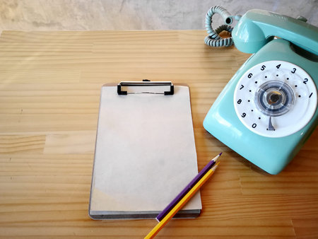Old telephone , Recycle paper and color pencil on tableの写真素材