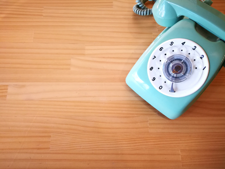 telephone on wood table of background conceptの写真素材