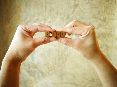 Alphabet of love on hand. Love and valentine conceptの写真素材
