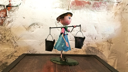 Kid doll on top wood tableの写真素材