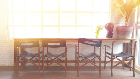 Wood chairs and table near the big windows .It is space  background conceptの写真素材