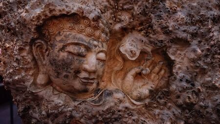 Buddha issue  wood carving backgroundの写真素材