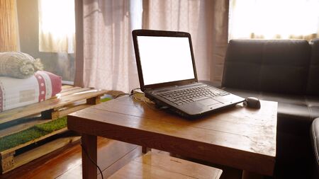 White screen in   Laptop.It put on the table in bedroom.work form idea conceptの写真素材