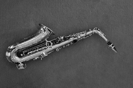Saxophone on floor .black and white art photo .Old Music concept