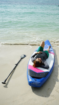 Women relaxing sleep on kayak sea boardの写真素材