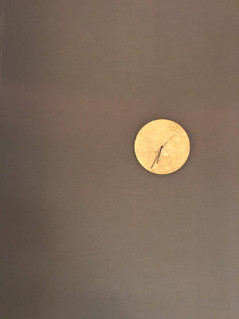 moon clock hang on the brown wall
