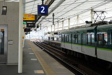railway station with train passing in Japan