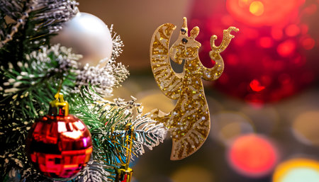 Christmas Tree With Decorations Near A Fireplace with Lights. Christmas background with christmas balls. christmas tree decorated with toys and balls. Christmas tree decorations on a blurred backgroundの素材