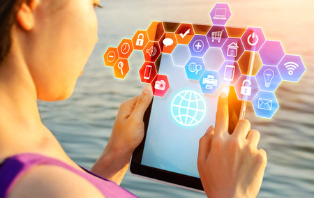 Close up of hand holding tablet with cloud network technology