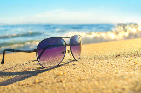 Sunglasses on the beachの写真素材