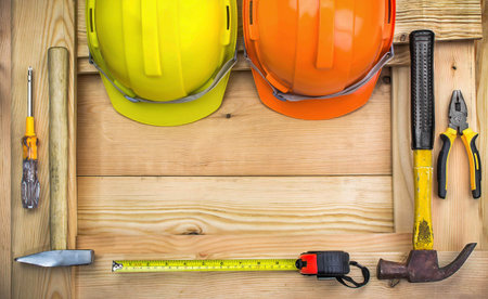 Construction tools on worker desk. Free space for text.