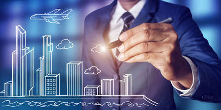 Businessman drawing city scheme conceptの写真素材
