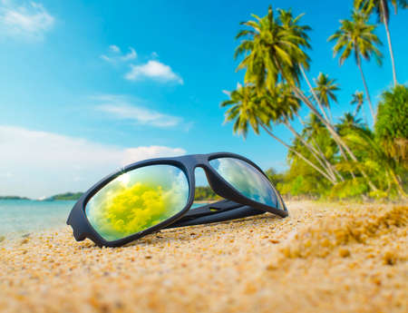 Sunglasses on the beachの写真素材