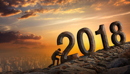 Business man pushing large stone up to hill  with numbers 2018 , Business heavy tasks and problems concept.の写真素材