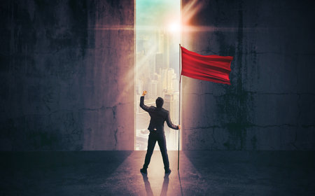 Businessman standing and holding red flag. Concept for success.の写真素材