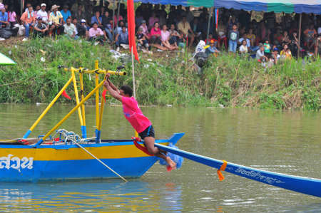 Chumphon, Langsuan, Thailand,  31 October ? 4 November 2012:Langsuan Traditional Long Boat racing festival is the only one of its type in Thailand (unseen Thailand) with grabbing the flag compete for the Royal Plaque and Trophies of H.M. the King and the のeditorial素材
