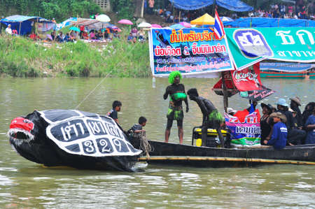 Chumphon, Langsuan, Thailand,  31 October ? 4 November 2012:Langsuan Traditional Long Boat racing festival is the only one of its type in Thailand (unseen Thailand) with grabbing the flag compete for the Royal Plaque and Trophies of H.M. the King and the のeditorial素材