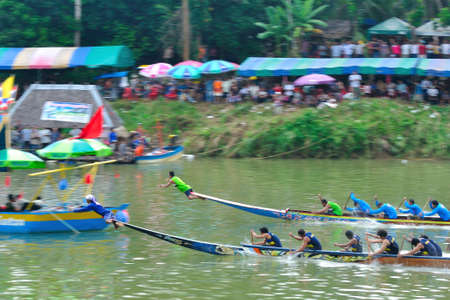 Chumphon, Langsuan, Thailand,  31 October ? 4 November 2012:Langsuan Traditional Long Boat racing festival is the only one of its type in Thailand (unseen Thailand) with grabbing the flag compete for the Royal Plaque and Trophies of H.M. the King and the のeditorial素材