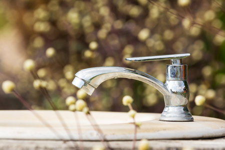 Water faucet on natureの写真素材