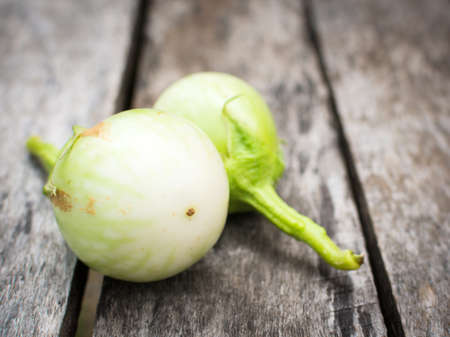 eggplant on wood backgroundの写真素材