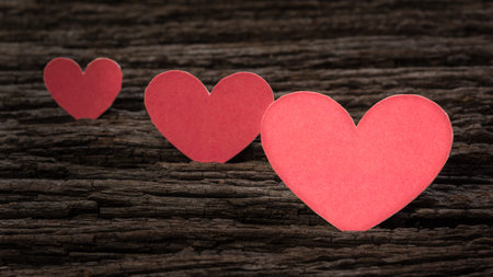Red Valentine heart on old rustic wooden background. Valentine's day.の写真素材