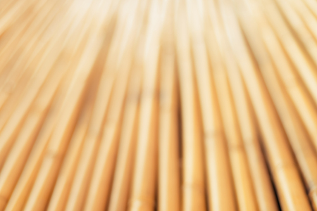 Golden bamboo fence background with shallow depth of field (dof)の写真素材