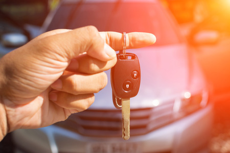 Car key in hand and color tone effectの写真素材