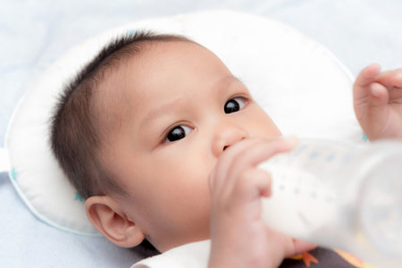 Baby Drinking Milk from Bottleの写真素材
