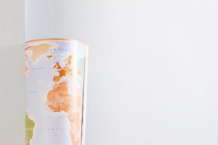 Map rolls see Europe and Africa, with white wall background, light impact.