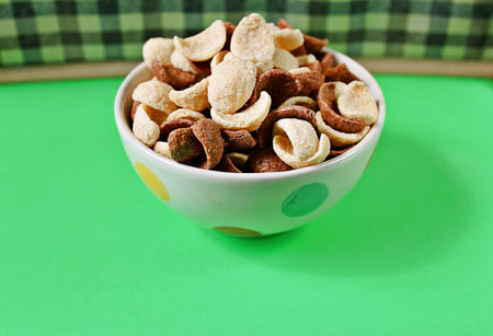 Confucius in small cups white dots On the green floor Brown background