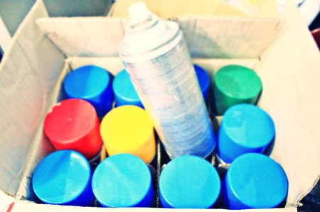 Spray can In the box are many red, yellow, greenの写真素材