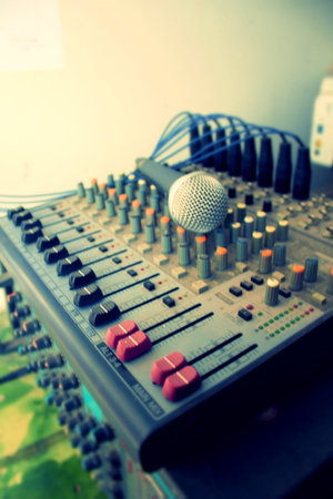 The microphone is placed on the audio controller. The amplifier has a large number of controls. The...