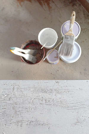 Cans and brushes painted white wooden backgroundのeditorial素材