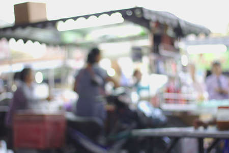 Mother sells drinking water Blurry motorcycle trailer.Motorcycle trailer, selling water, trader is sellingのeditorial素材