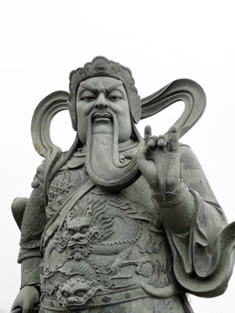 The statue of the Chinese God isolated on white background.の写真素材